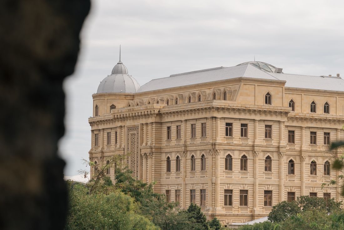 Historic building framed by greenery, Baku