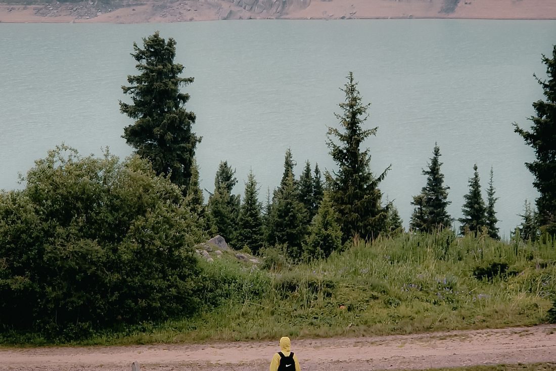 Traveller at a mountain lake, Almaty